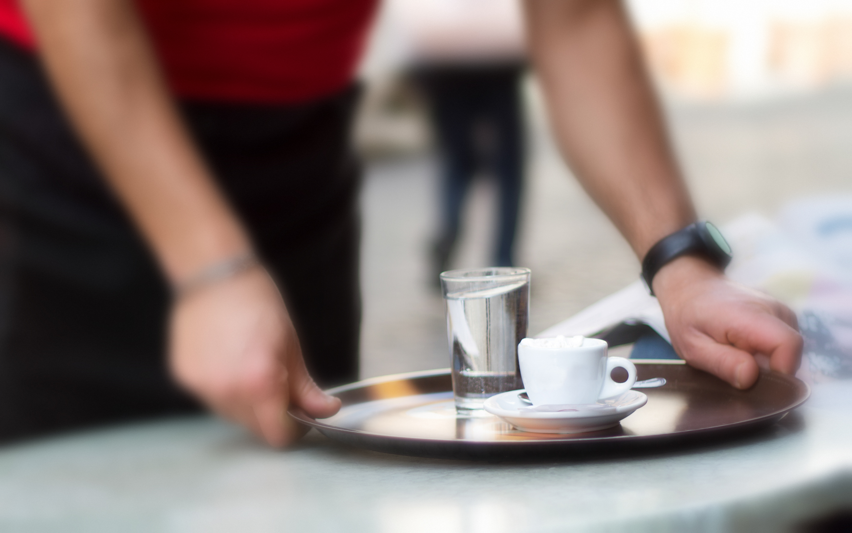 Italy: Barista Sets Down Tray with Coffee at Outdoor Cafe